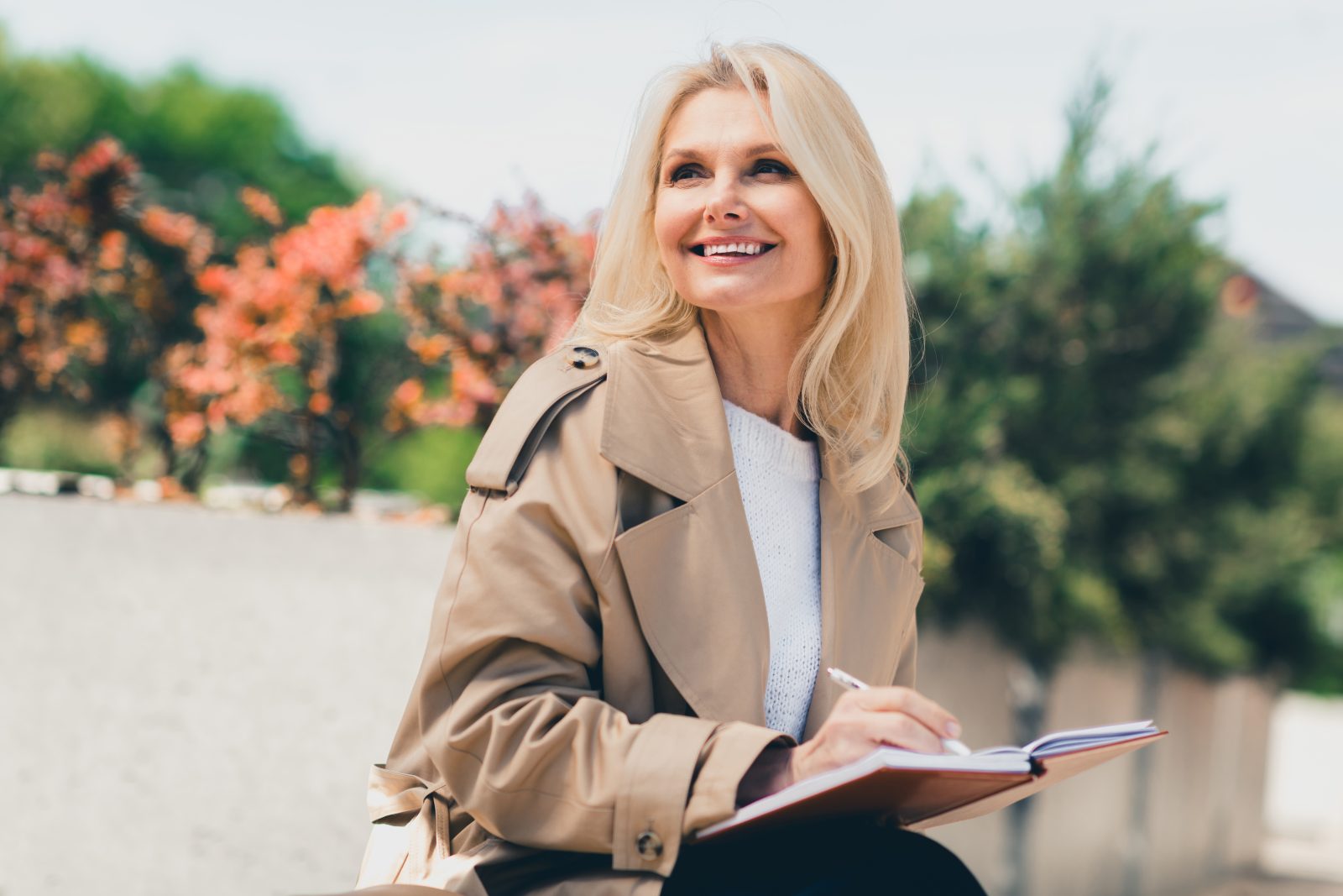 Woman writing in a notebook outdoors – online psychiatry in Hillsboro, OR